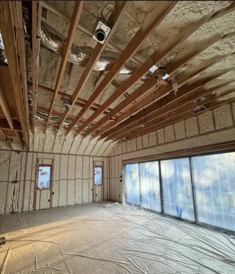 Interior walls and ceiling insulated with spray foam during new construction in Watertown